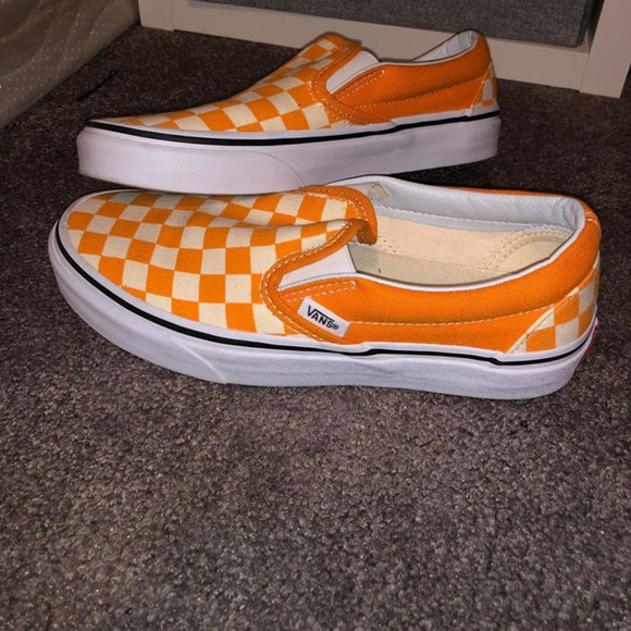 orange and white slip on vans